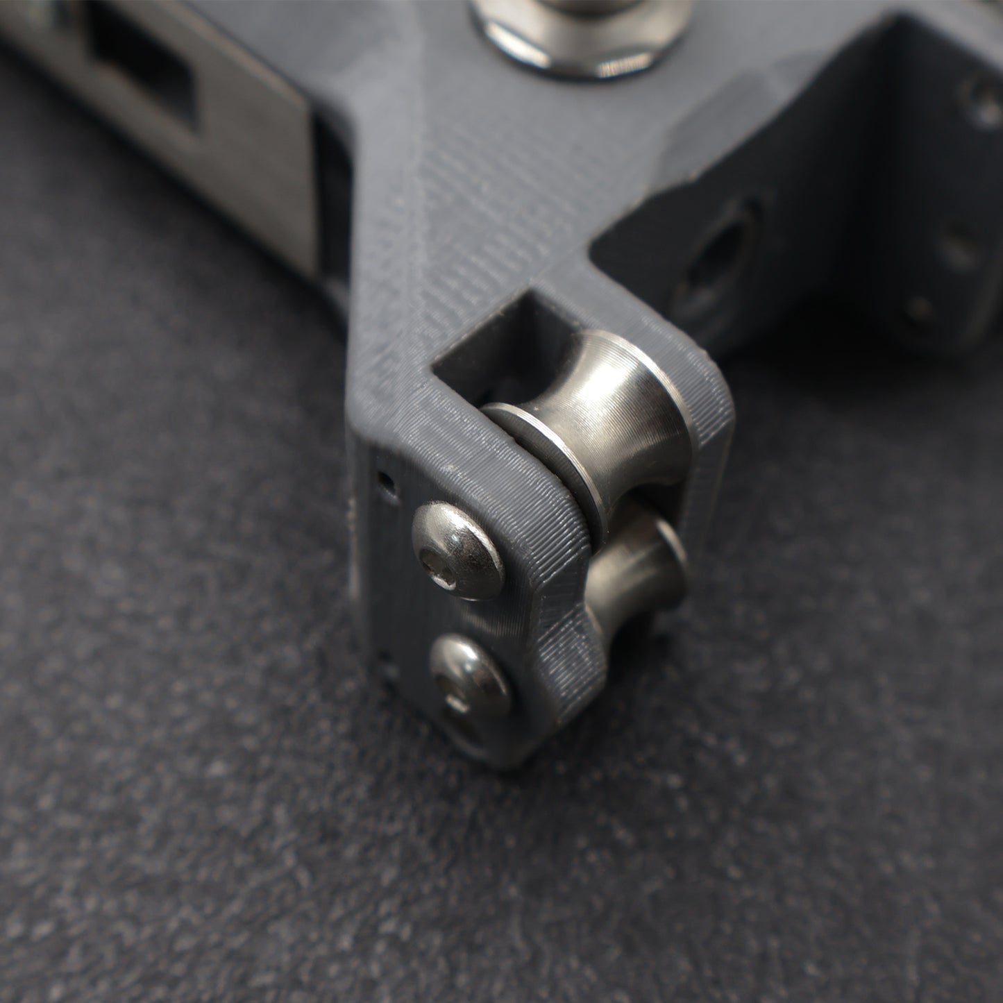 3D Printed Gray Hollow Repeating Slingshot (convex screws)